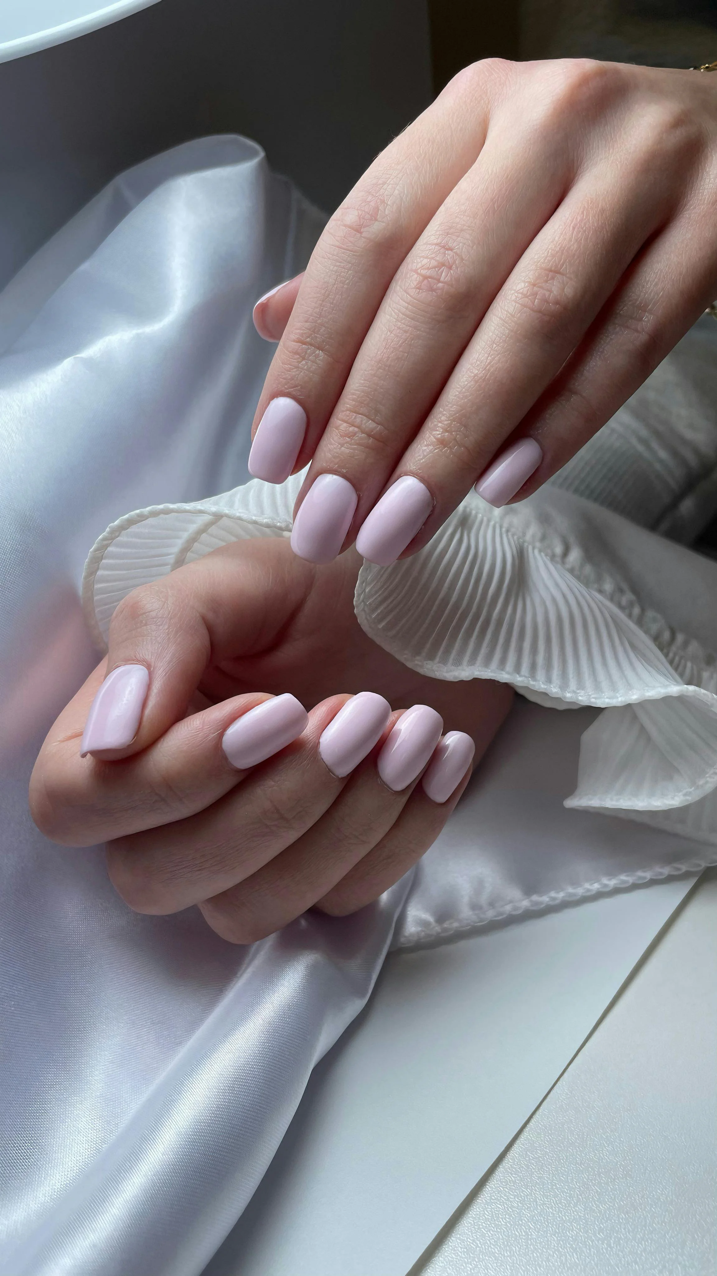 Elegant pink manicure on silk